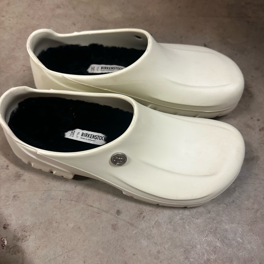 Cream colored fur lined Birkenstocks